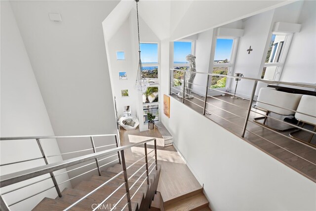 766 Pelican, Laguna Beach, CA 92651 - stairway featuring wood finished floors and high vaulted ceiling