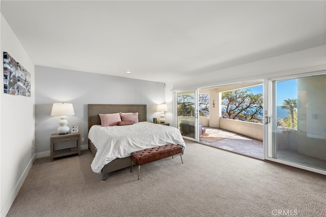 carpeted bedroom with access to outside