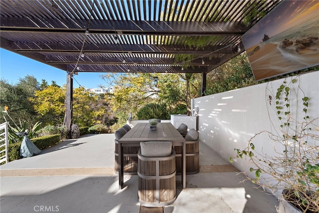 766 Pelican, Laguna Beach, CA 92651 - view of patio / terrace with outdoor dining space, a pergola, and view of scattered trees