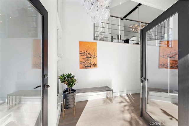 766 Pelican, Laguna Beach, CA 92651 - bathroom featuring a chandelier and wood finished floors