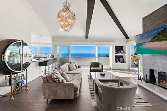 766 Pelican, Laguna Beach, CA 92651 - living area with a chandelier, wood finished floors, a tile fireplace, and healthy amount of natural light