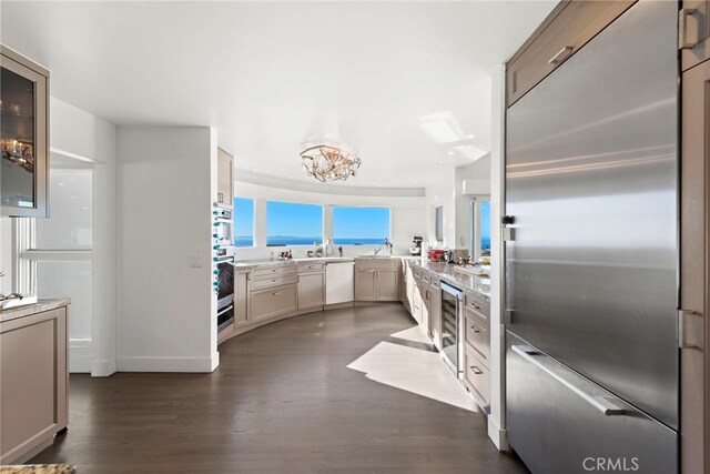 766 Pelican, Laguna Beach, CA 92651 - kitchen featuring built in fridge, dishwashing machine, dark wood-style floors, wine cooler, and light countertops
