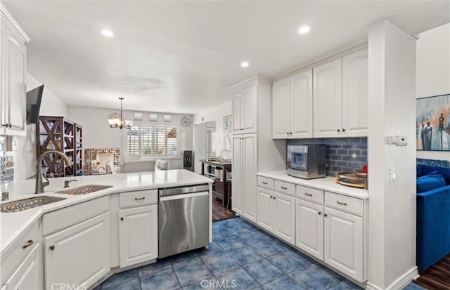 kitchen featuring sink, white cabinetry, stainless steel dishwasher, pendant lighting, and backsplash