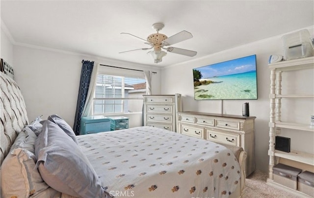 carpeted bedroom with crown molding and ceiling fan