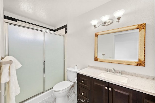 bathroom with walk in shower, vanity, and toilet