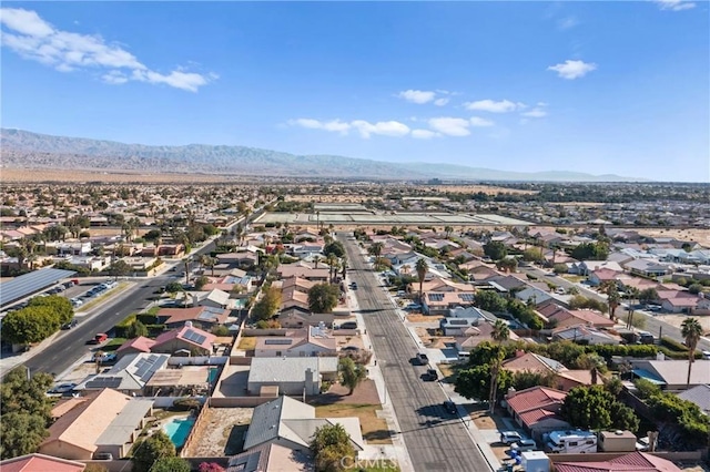 birds eye view of property featuring a mountain view