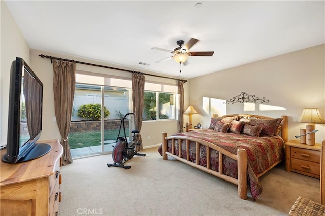 bedroom with light carpet, access to outside, and ceiling fan