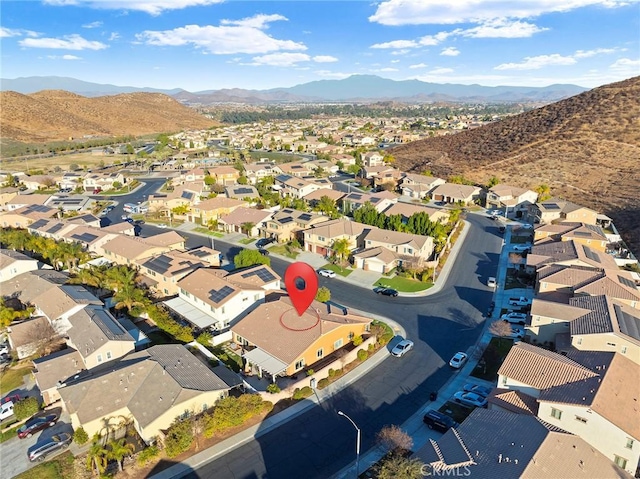 birds eye view of property featuring a mountain view