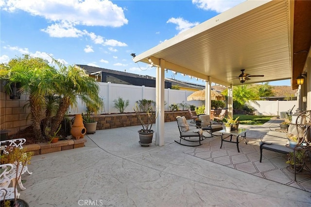 view of patio featuring ceiling fan