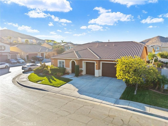 mediterranean / spanish-style house featuring a garage