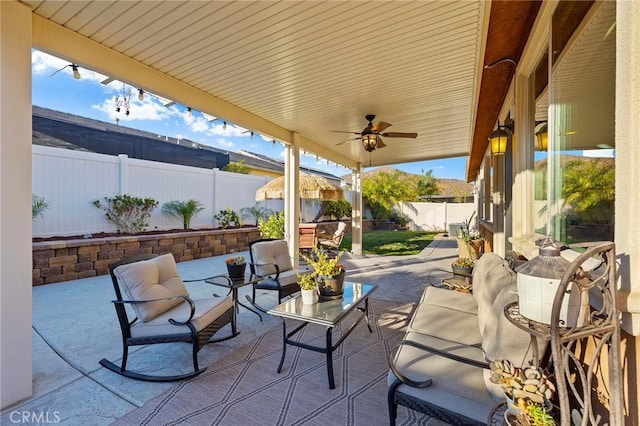 view of patio / terrace featuring ceiling fan and outdoor lounge area