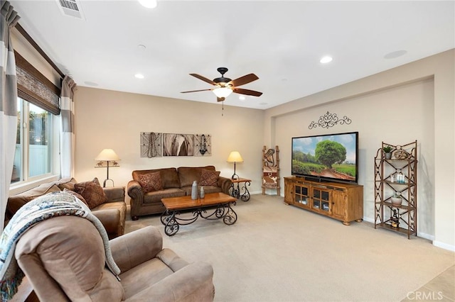 living room featuring ceiling fan and carpet floors