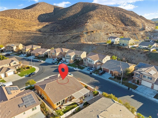 birds eye view of property with a mountain view