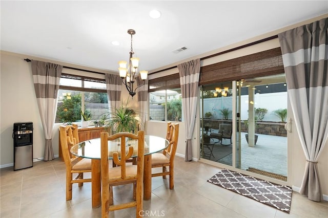 dining area featuring an inviting chandelier