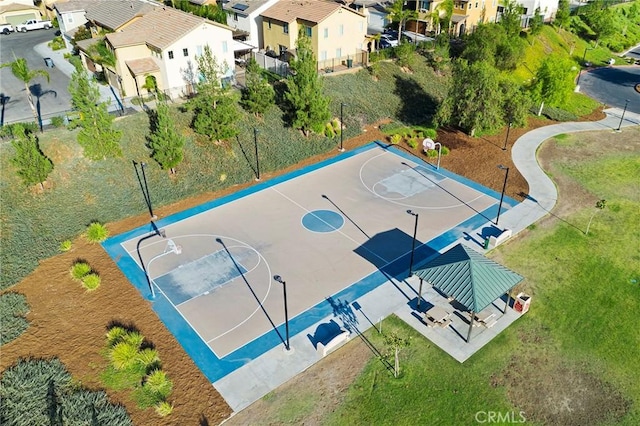 view of basketball court featuring a yard