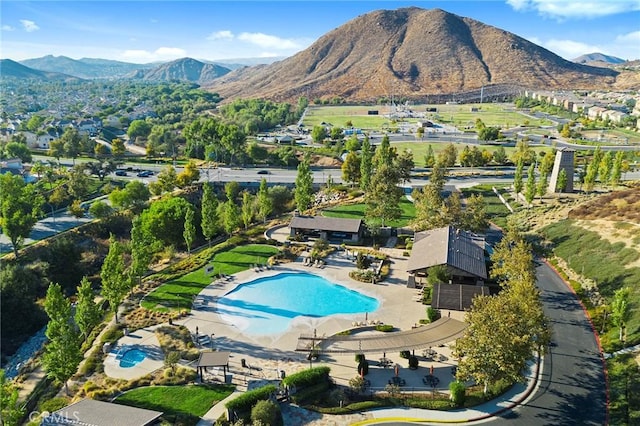 birds eye view of property with a mountain view