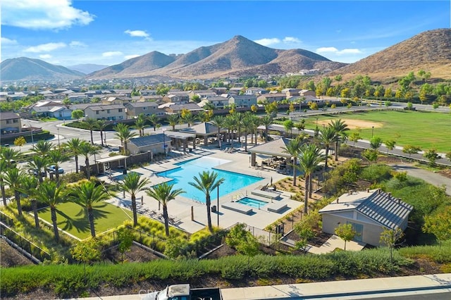 view of swimming pool featuring a mountain view and a patio