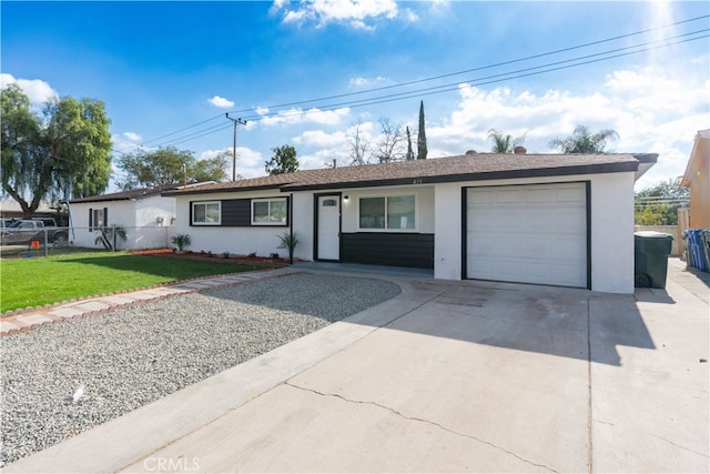 single story home with a garage and a front lawn