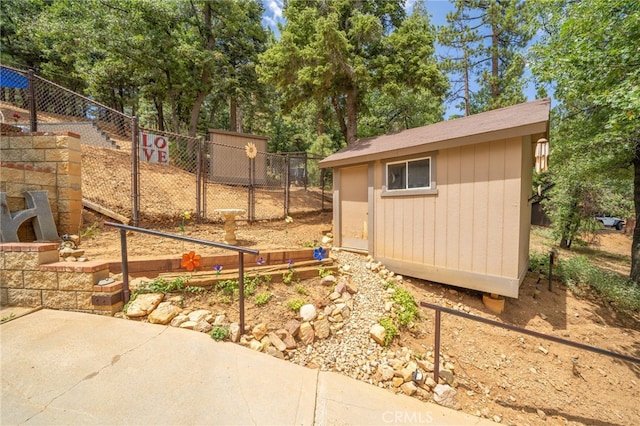 exterior space with a storage shed