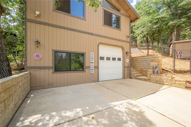 view of property exterior featuring a garage