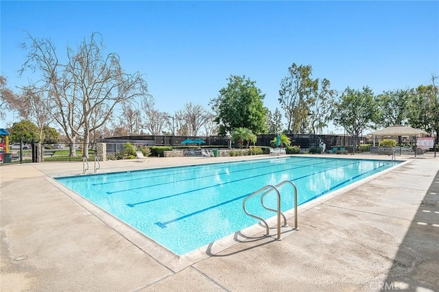 view of swimming pool featuring a patio area