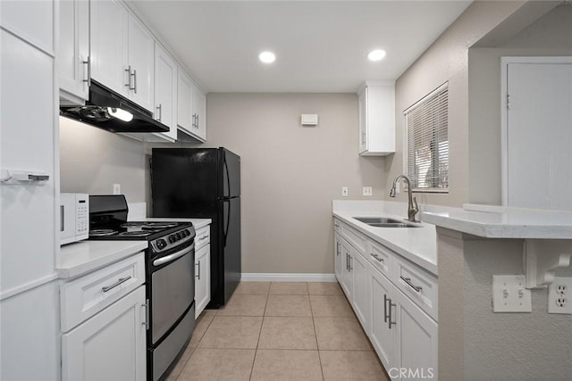 kitchen featuring white cabinets, black range oven, and sink