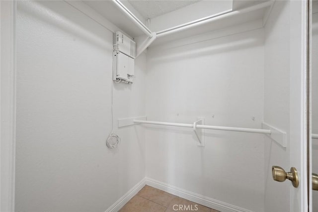 spacious closet with light tile patterned flooring