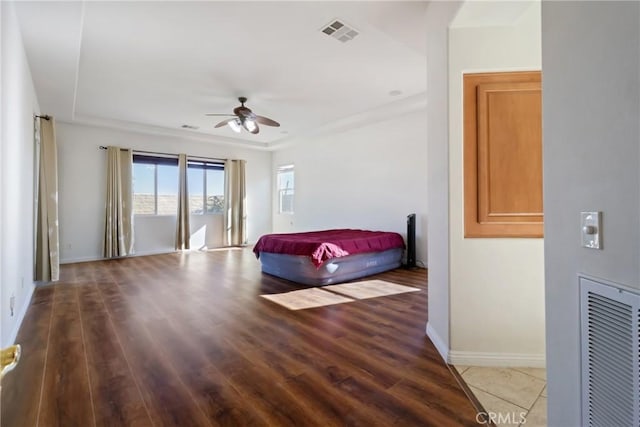 bedroom featuring ceiling fan and wood-type flooring