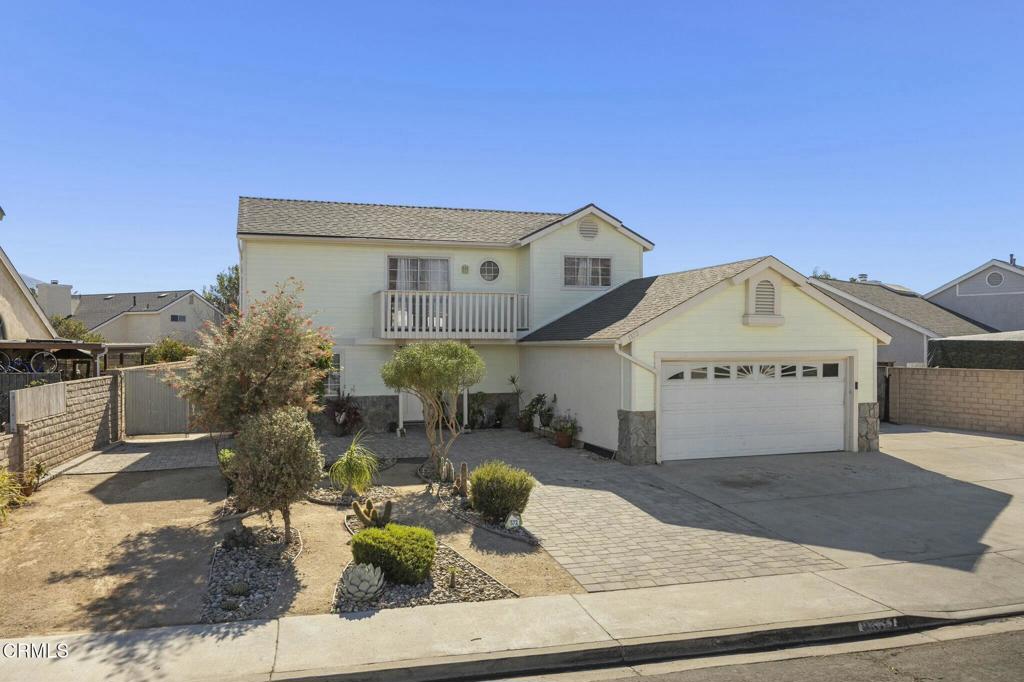 view of front of house with a garage and a balcony