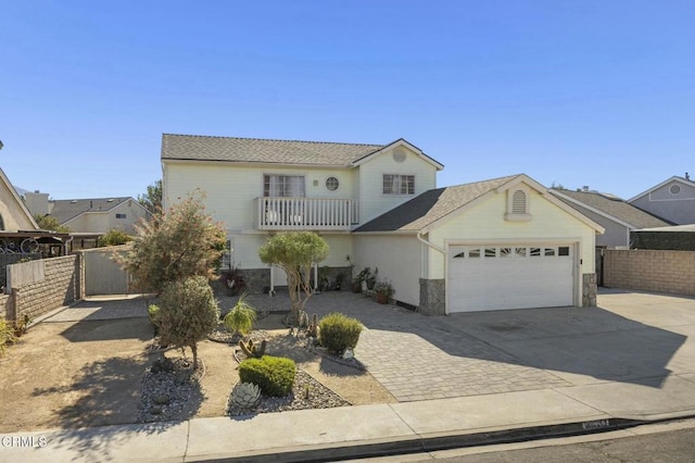 view of front of house with a garage and a balcony