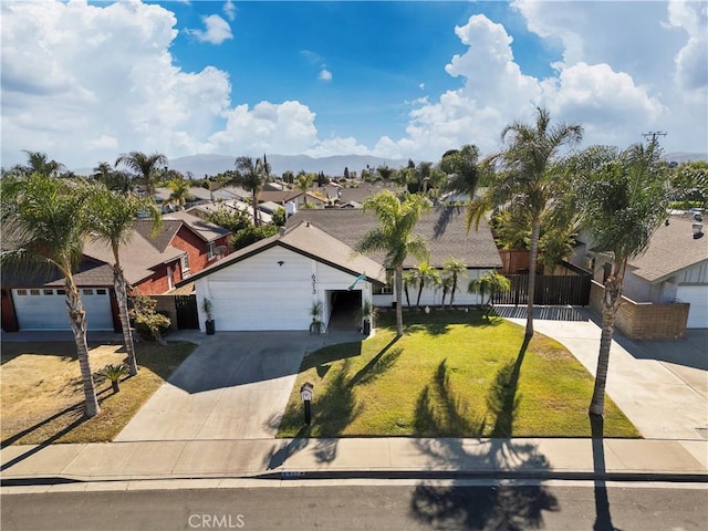 view of front of property with a front lawn and a garage