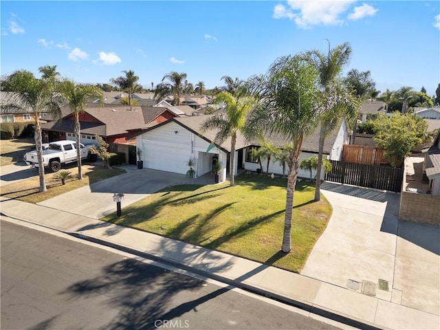 view of front of home featuring a garage and a front lawn