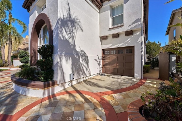 view of property exterior featuring a garage