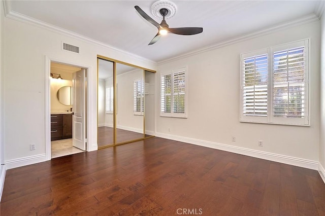 unfurnished bedroom featuring ceiling fan, hardwood / wood-style flooring, and ornamental molding