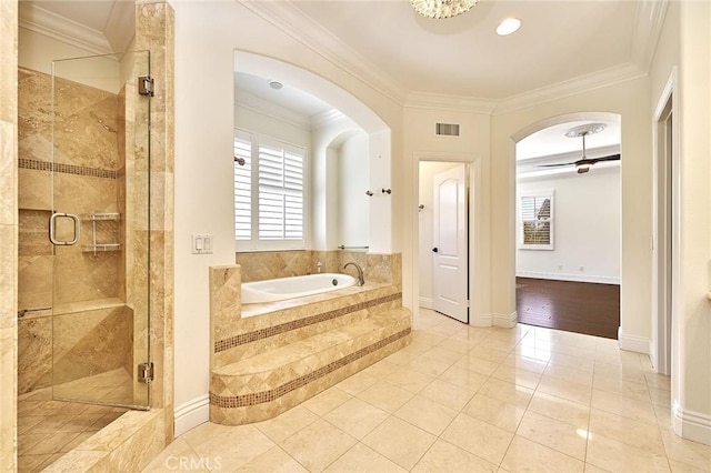 bathroom featuring tile patterned floors, ornamental molding, and separate shower and tub