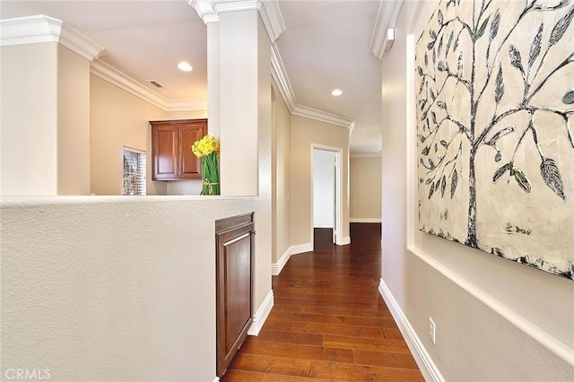 corridor featuring dark wood-type flooring and ornamental molding