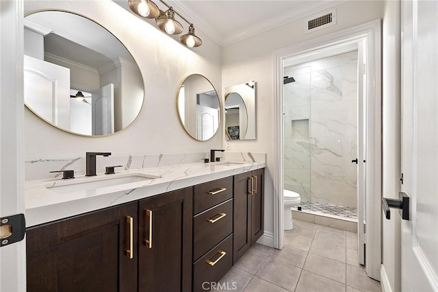 bathroom featuring tile patterned flooring, vanity, toilet, walk in shower, and crown molding