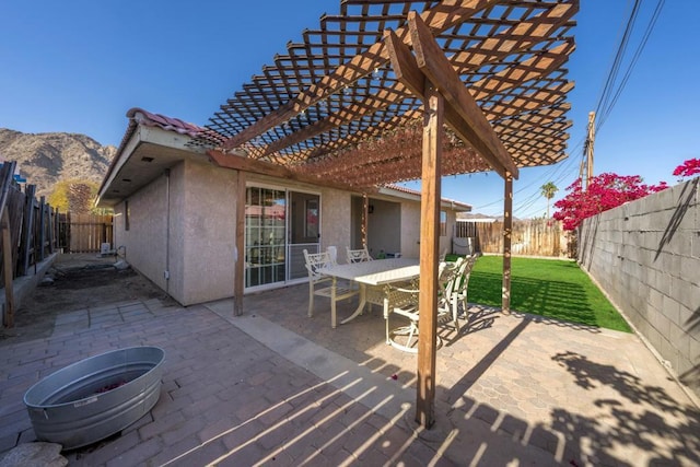 view of patio featuring a mountain view and a pergola