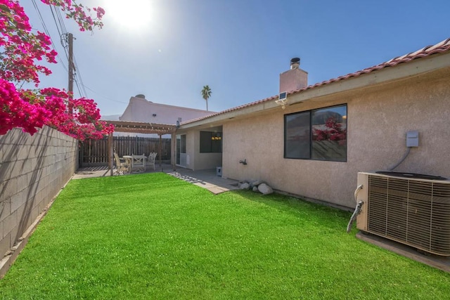 exterior space featuring central AC unit, a yard, and a patio