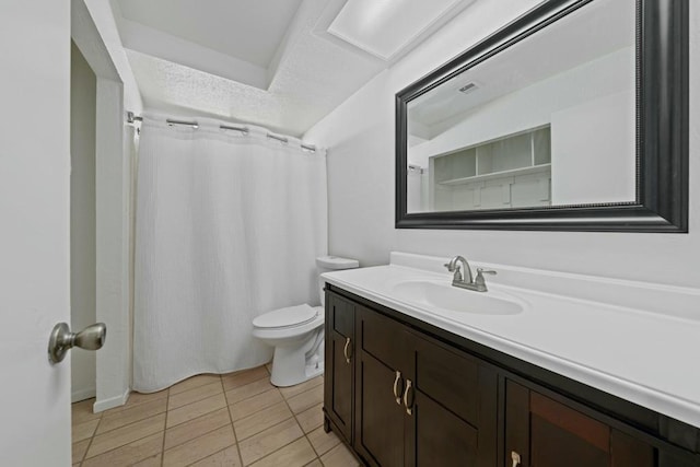 bathroom with tile patterned floors, vanity, and toilet