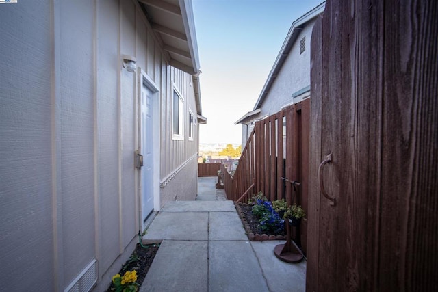 view of side of property with a patio