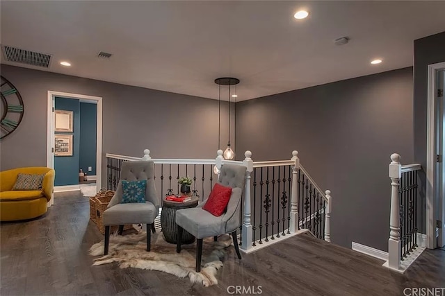 sitting room with dark hardwood / wood-style flooring