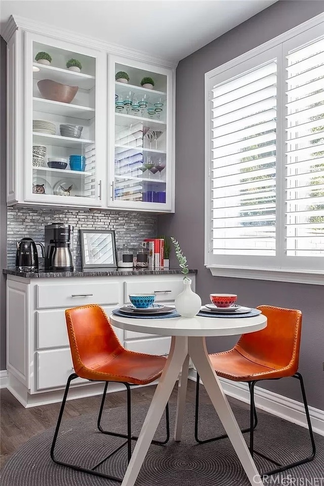 dining area with dark hardwood / wood-style flooring and a wealth of natural light