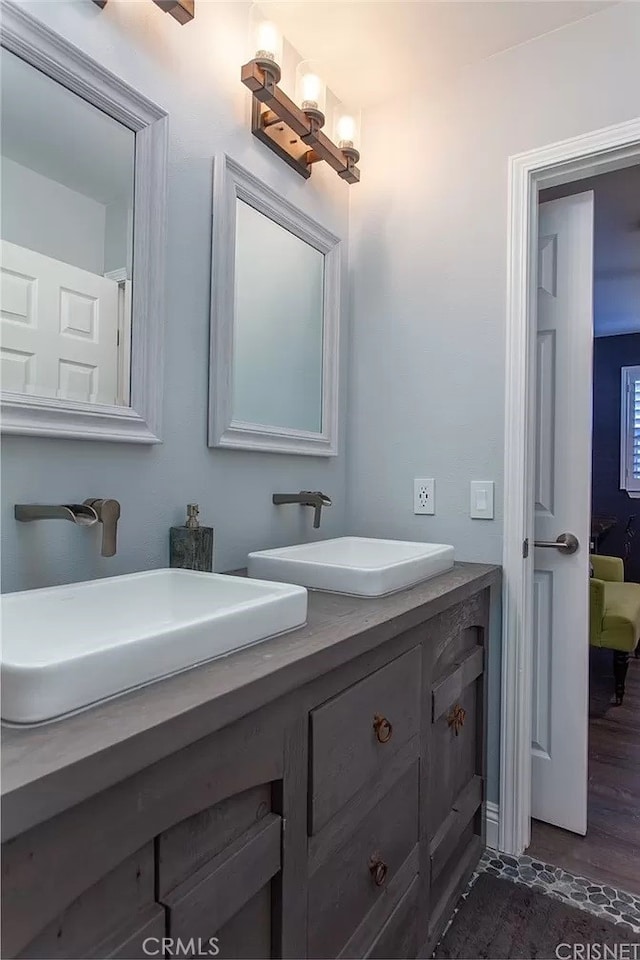 bathroom featuring hardwood / wood-style floors and vanity