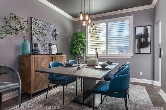 dining space featuring dark hardwood / wood-style floors and ornamental molding