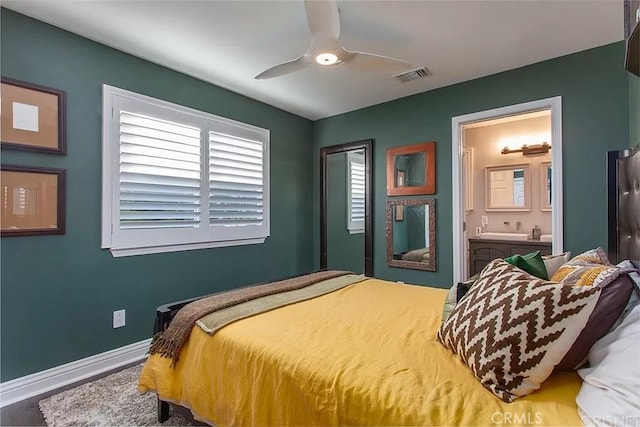 bedroom featuring ceiling fan and connected bathroom