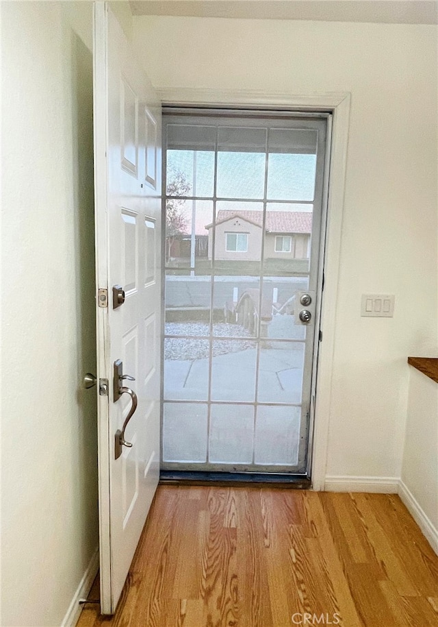 entryway with light hardwood / wood-style flooring