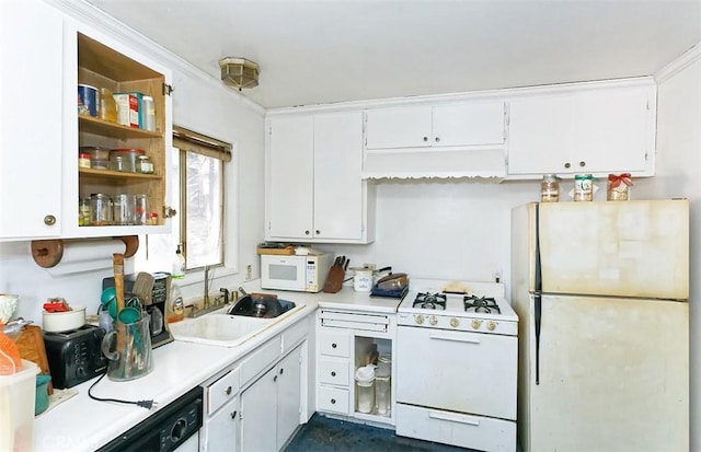 kitchen featuring sink, white appliances, white cabinets, and ornamental molding