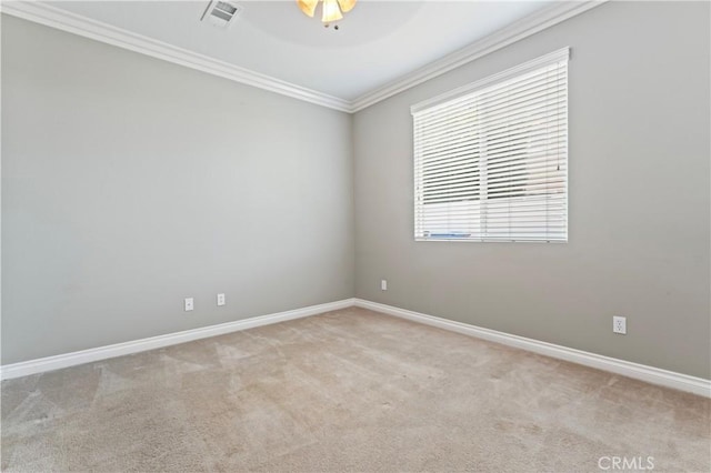 carpeted empty room with crown molding and ceiling fan