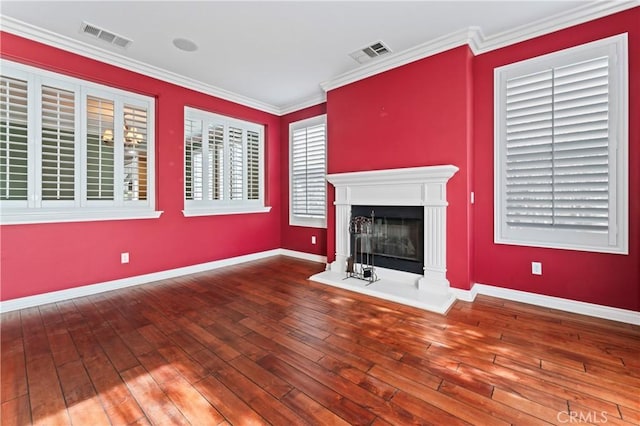 unfurnished living room featuring crown molding and wood-type flooring